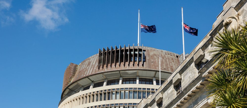 Parliament building in Wellington (New Zealand), flags at half-mast