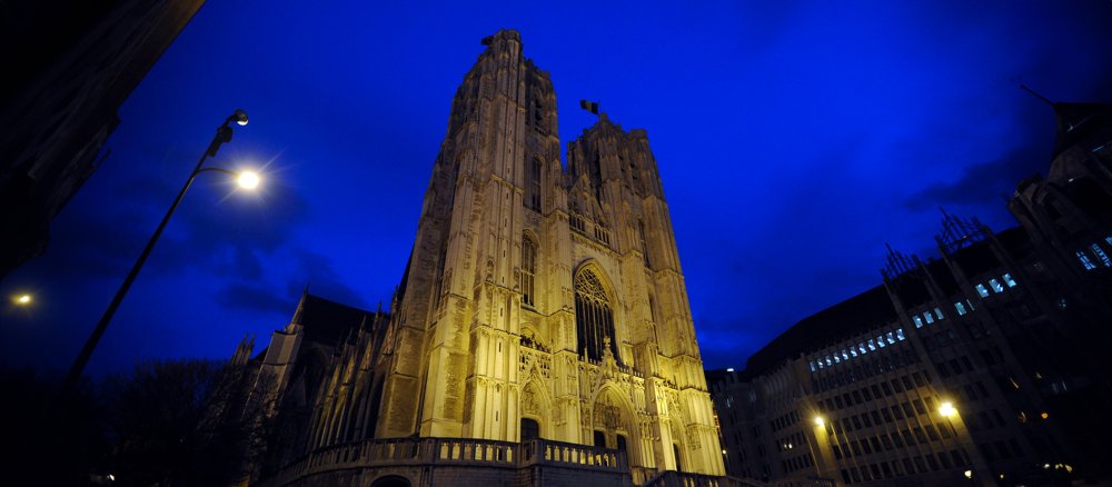 Exterior view of the main façade of Saint-Michel et Gudule Cathedral in the evening light.