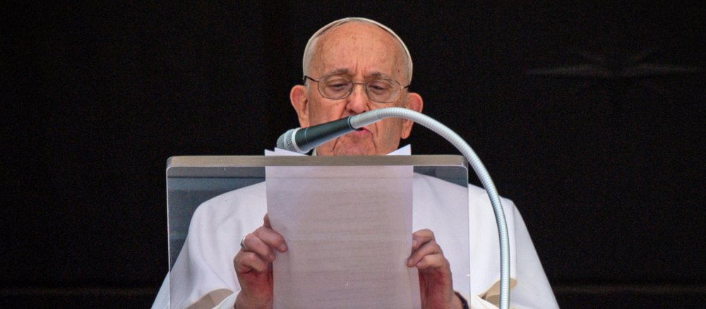 Pope Francis speaks at the window of the Apostolic Palace at the Angelus Prayer