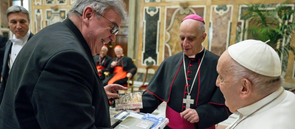 Monsignor Georg Austen speaks with Pope Francis