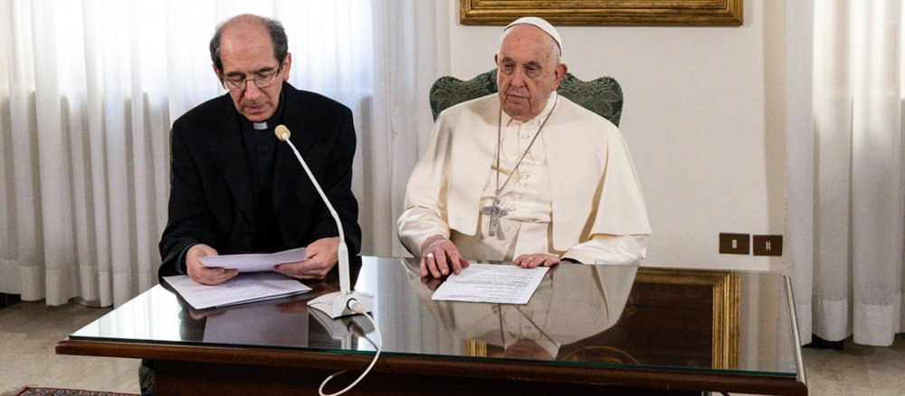 Pope Francis at a table during the Angelus
