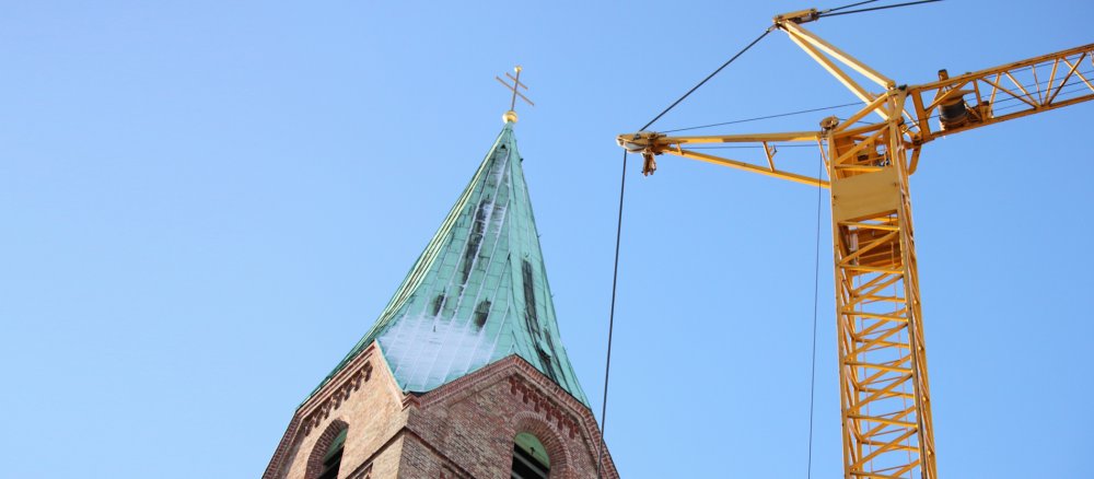 Construction crane next to a church