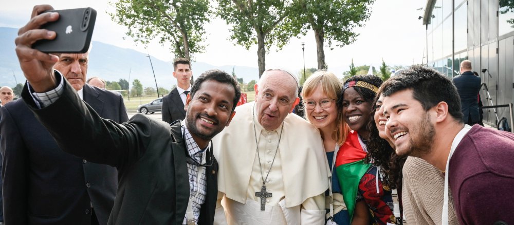Pope Francis poses for a selfie with young people