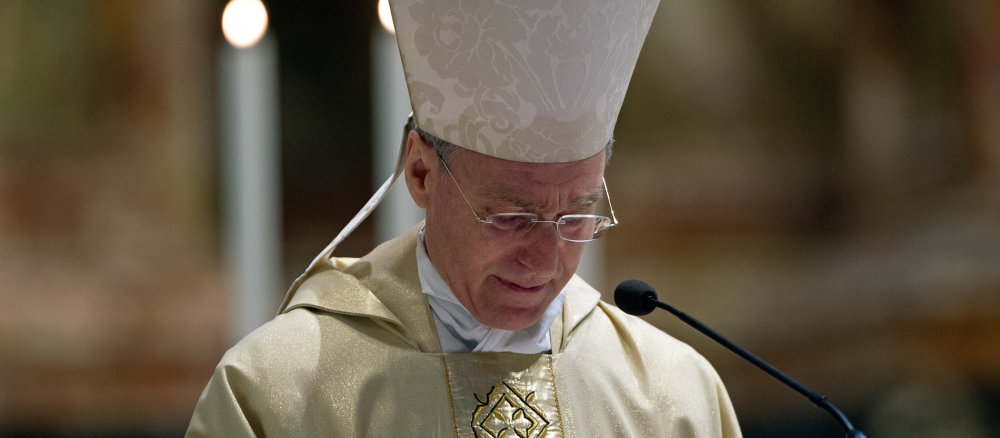 Archbishop Georg Gänswein cries during a memorial mass