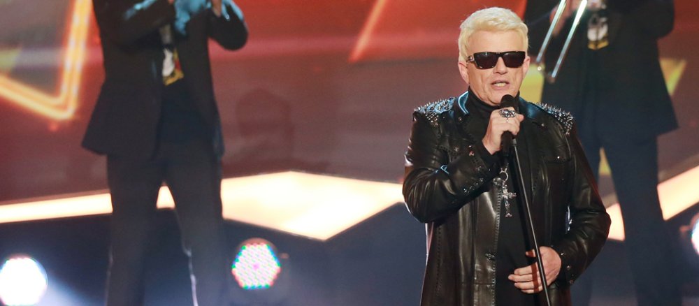 Heino performing on stage.