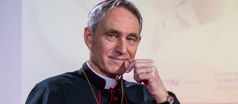 Archbishop Georg Gänswein smiles during an interview