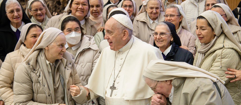 Pope Francis surrounded by women religious