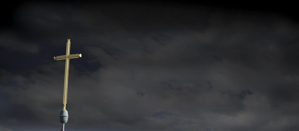 A cross against a black sky