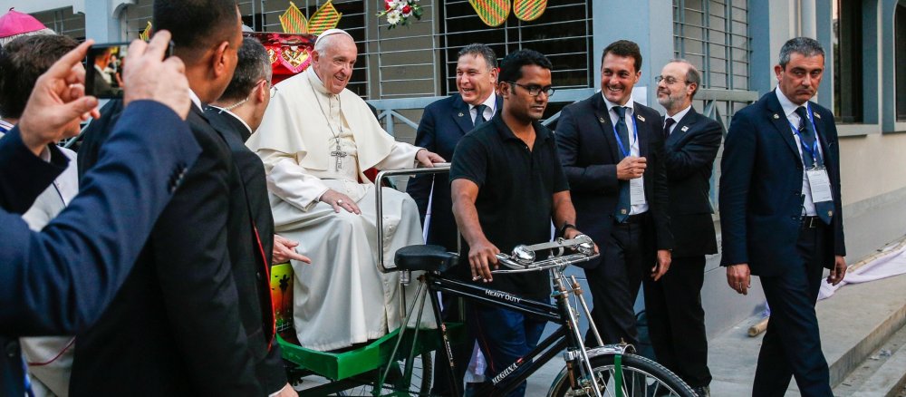 Pope Francis in a rickshaw