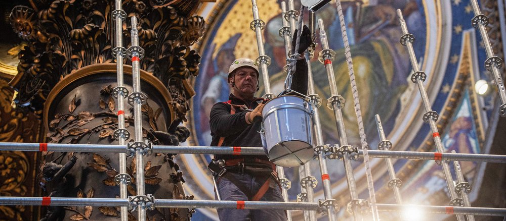 Workmen assemble scaffolding on the bronze canopy of Gian Lorenzo Bernini in St Peter's Basilica in the Vatican on 21 February 2024.
