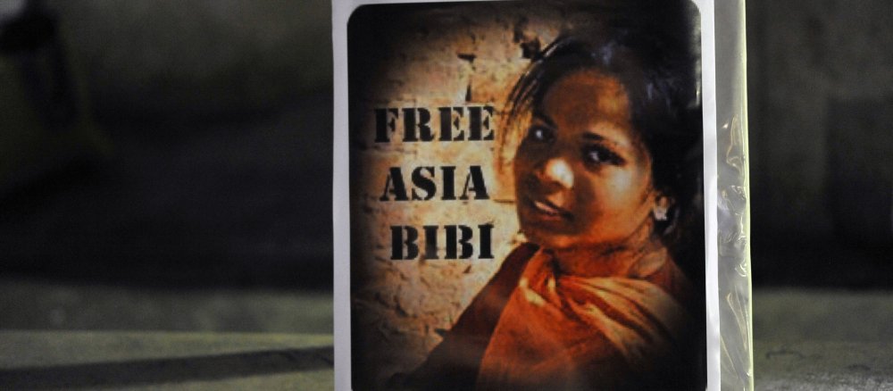 Ein Plakat mit einem Porträt der pakistanischen Christin Asia Bibi