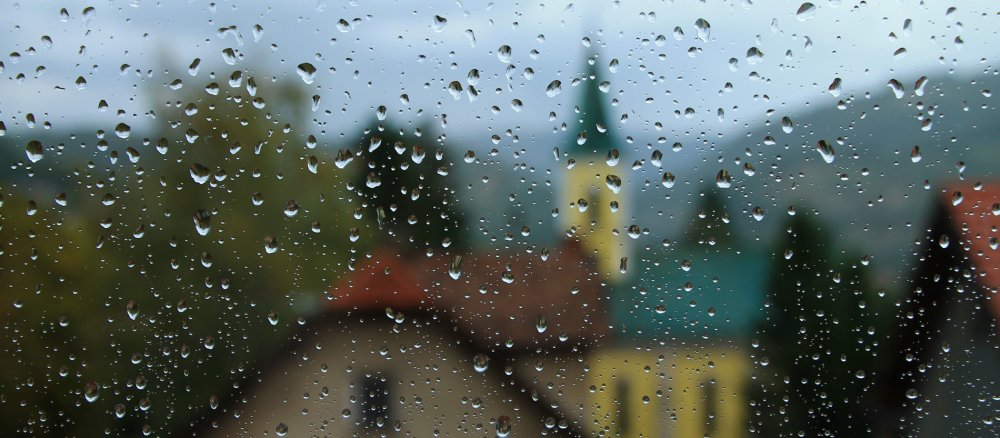 A village church stands in the November rain.