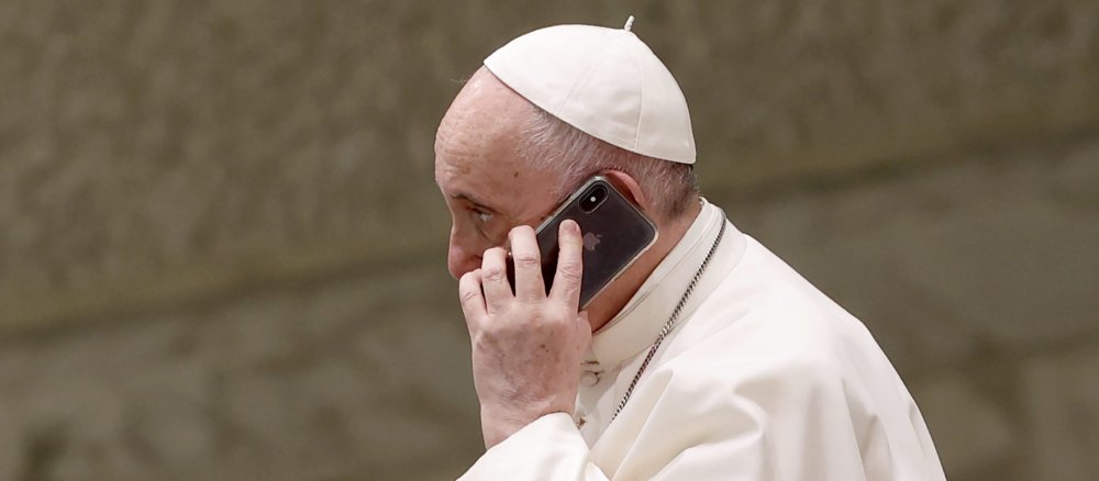 Pope Francis makes a phone call with a smartphone