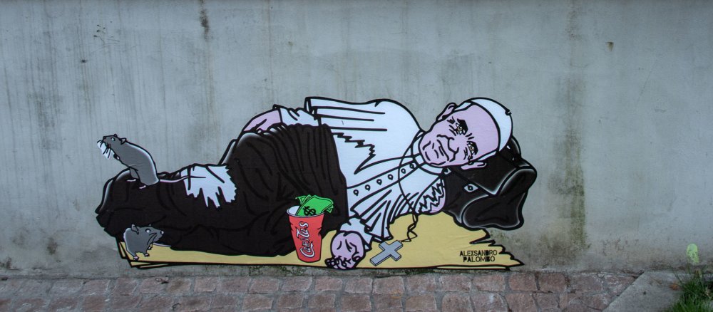 Ein Graffito zeigt Papst Franziskus als Bettler