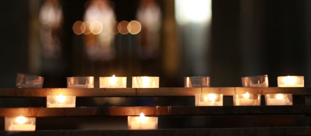 Sacrificial lights stand in a church.