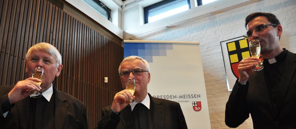 Domdekan Klemens Ullmann, Bischof Heiner Koch und Andreas Kutschke.